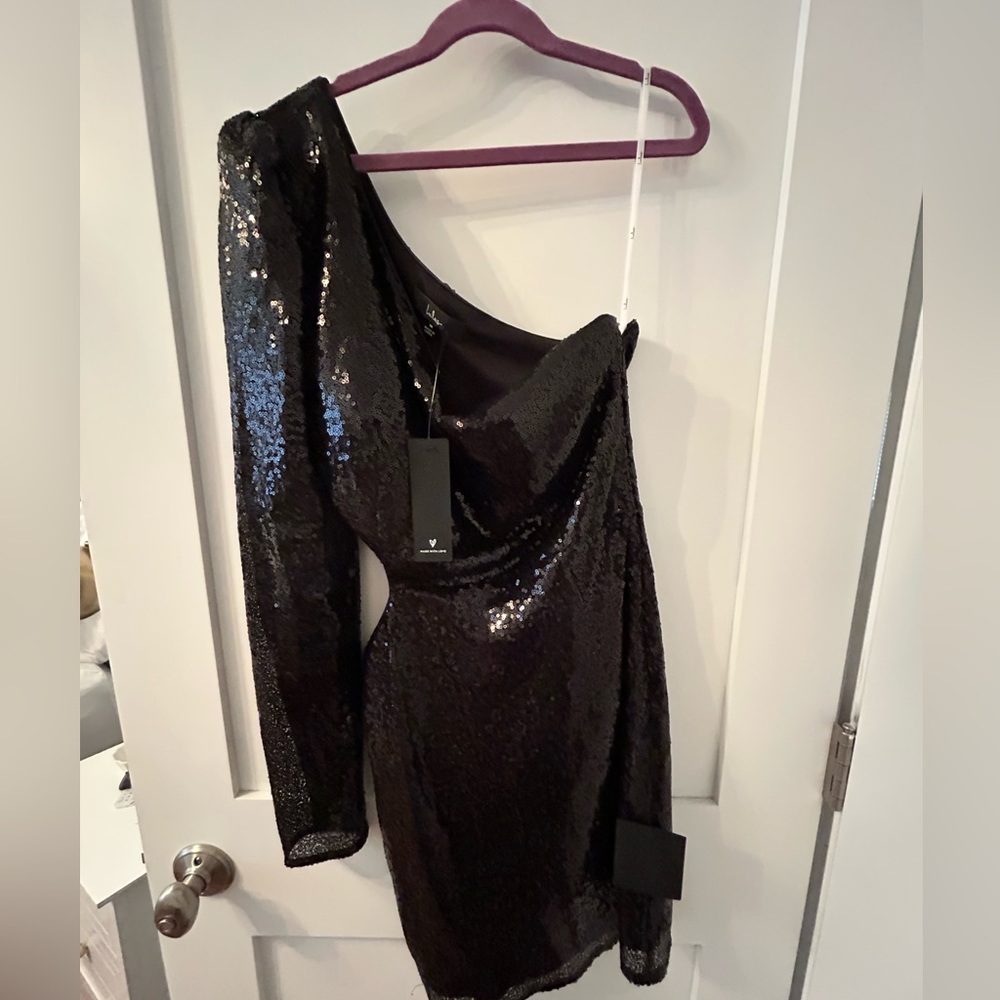 New with tags size M Lulus black sequined dress. One armed (right) w cutout